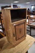 A vintage stripped bedside cabinet