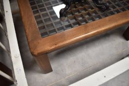 An interesting coffee table having wood grid frame and glass top, approx. 90 x 90cm