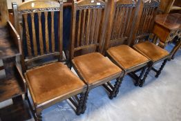 A set of four 1940's barley-twist oak dining chairs with arched and moulded top rails, slatted backs