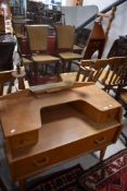 A vintage golden oak dressing table in the Gomme G plan style, with torch style mirror lights, width
