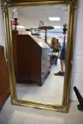 A modern filt frame mirror, approx. 130 x 76cm