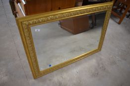 A modern gilt frame wall mirror, landscape hung, approx. 73 x 102cm
