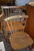 A vintage spindle back kitchen chair in the Ercol style, and similar carver chair (af)