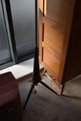 A vintage standard lamp having rocket style base