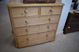 A stripped pine chest of two over three drawers, approx dimensions H117 W122 D56cm