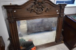 A large over mantel hardwood wall mirror, width approx. 153cm