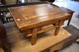 A 19th/20th century Chinese elm low tea table, of rustic construction, having planked and framed top