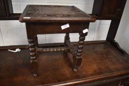 A late 19th or early 20th Century carved stool havig bobbin frame, approx. 33 x 33cm