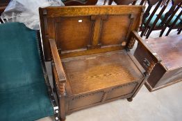An early to mid 20th Century oak monks bench