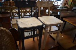 A pair of stripped ply chairs