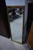 A modern gilt frame wall mirror, approx. 96 x 34cm