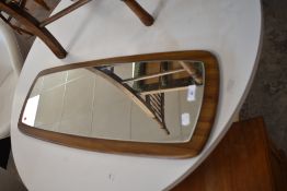 A vintage teak effect wall mirror, approx. 77 x 29cm
