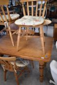 A traditional pine kitchen table and chairs