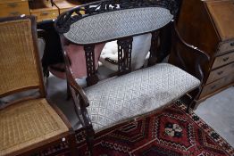 A Victorian rosewood salon settee, width approx. 116cm