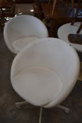 Two vintage style white vinyl swivel chairs