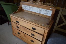 A Victorian stripped wash stand having tiled back, width approx. 105cm