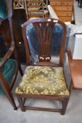 A period oak dining chair having feathered back and drop in upholstered seat, possible cut down