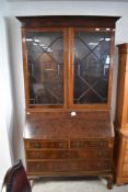 An early 20th century mahogany bureau bookcase, having astral glazed display section