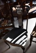 An Edwardian mahogany salon chair