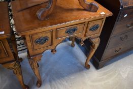 A reproduction Queen Anne style walnut lowboy, width approx. 69cm