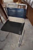 A set of four vintage Bauhaus style chrome and leather dining chairs in the style of Ludwig Mies Van