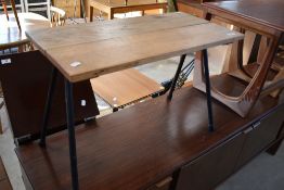 A vintage style occasional table having metal splay legs, approx. 71 x 35cm