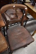 A Victorian Mahogany James Reilly pegged balloon back dining chair, with carved mid-rail over the