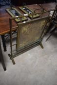 A Victorian brass and beadwork firescreen, of square out-line with carrying handle to the top with