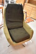 A vintage swivel lounge chair in the Eames /Peter Hoyte style