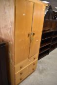 A vintage satin style sapele wardrobe, having three drawers to base, approx dimensions W81 H178cm