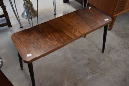 A vintage coffee table of small proportions