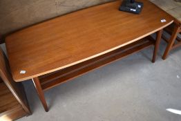 A vintage coffee table having slatted undertier, approx 105 x 44cm