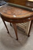 An Oriental style half moon side table
