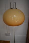 A vintage Chrome standard lamp having perspex shade