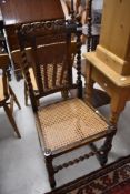 A late 19th Century oak twist frame dining chair having bergere seat and back