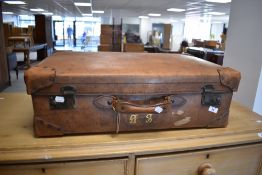 A vintage leather travel case with gilt monogram AS