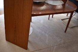 A vintage teak extending dining table, possibly G plan