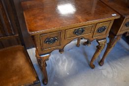 A reproduction Queen Anne style walnut lowboy, width approx. 69cm