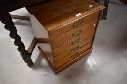 A late 19th or early 20th Century music cabinet
