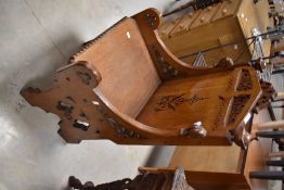 A Victorian Gothic oak hall chair , width approx. 51cm