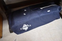 A Graco travel cot