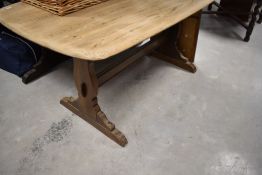 A part stripped Ercol refectory style dining table