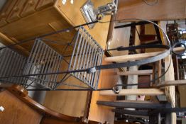 A wrought metal plant stand