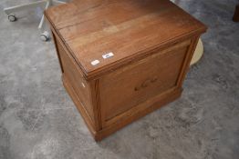 An early to mid 20th Century golden oak bedding box, approx width 54cm