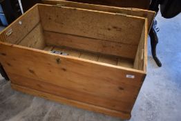 A late 19th/early 20th century pine blanket box, of traditional design, top loose with damage