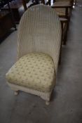 A traditional Lloyd Loom nursing chair