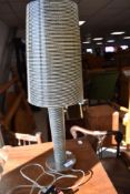 A modern table lamp in the style of Marc Sadler Foscarini