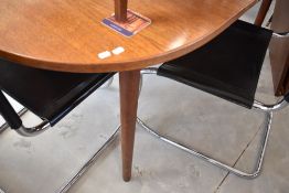 A vintage teak extending dining table, possibly G plan