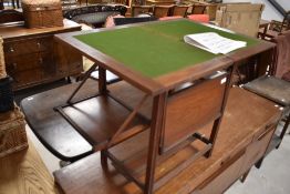 A late 19th or early 20th Century mahogany metamorphic games table