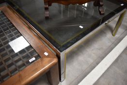 A chrome and smoked glass coffee table approx. 91 x 91cm